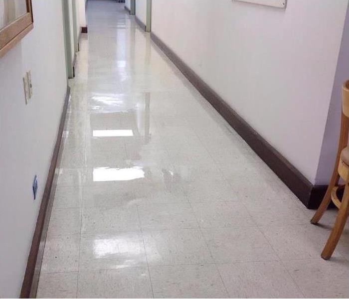 flooded hallway with tile flooring