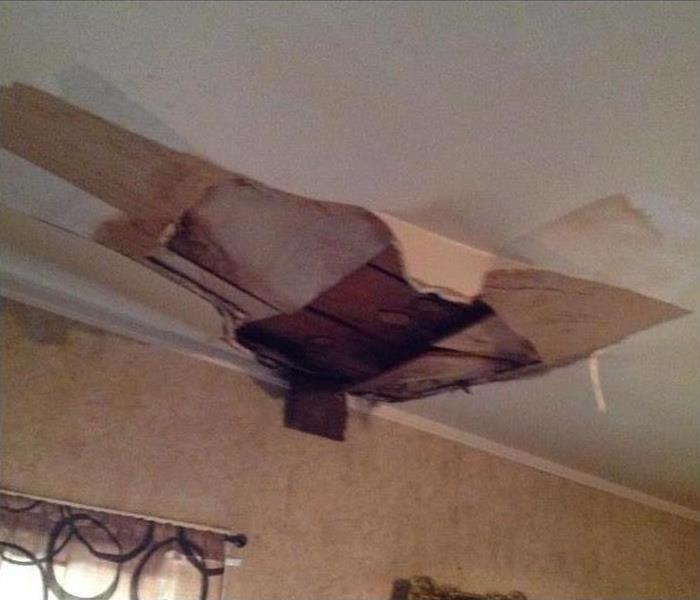 wind damaged caved in ceiling