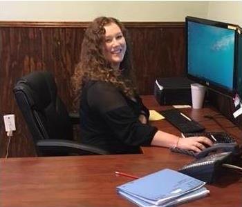 picture of Kristian Furbush at her desk