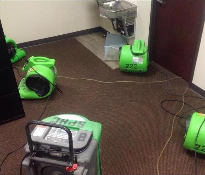 green servpo drying equipment on carpeting